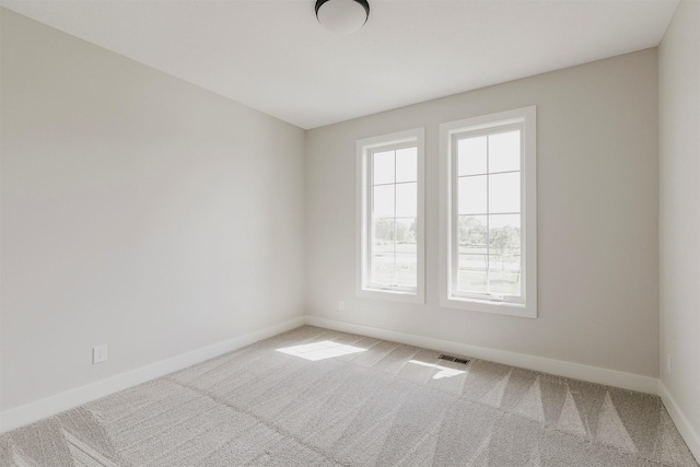 703 Richland Ct, Van Meter, IA 50261 - carpeted spare room featuring baseboards