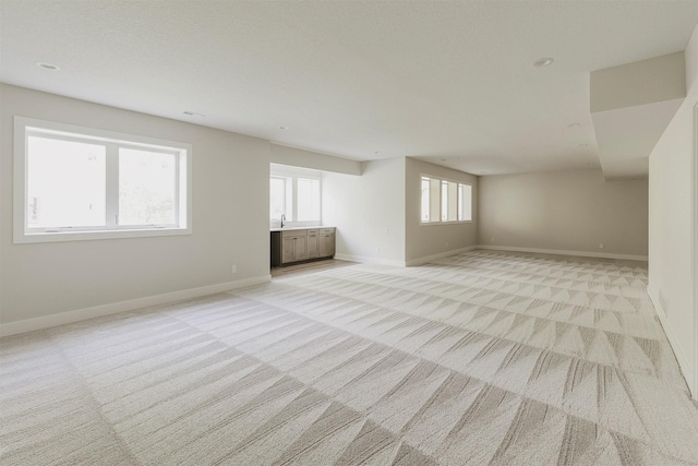 703 Richland Ct, Van Meter, IA 50261 - unfurnished room with light carpet