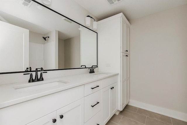 703 Richland Ct, Van Meter, IA 50261 - bathroom with tile patterned floors and double vanity