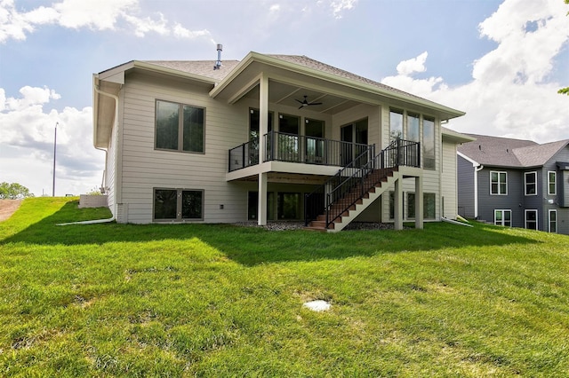 703 Richland Ct, Van Meter, IA 50261 - back of house featuring a yard, stairs, ceiling fan, and a wooden deck