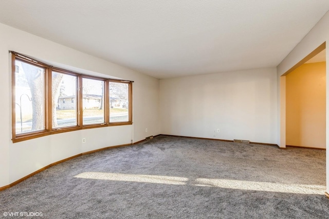 empty room featuring carpet flooring