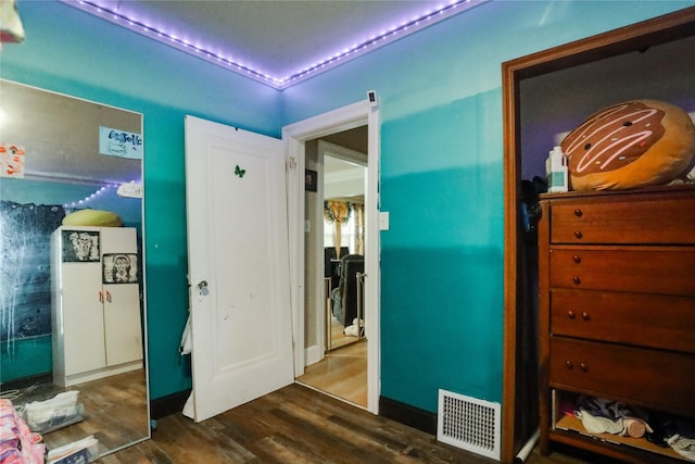 interior space with dark hardwood / wood-style flooring