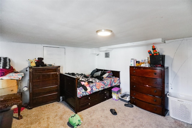 bedroom with light colored carpet