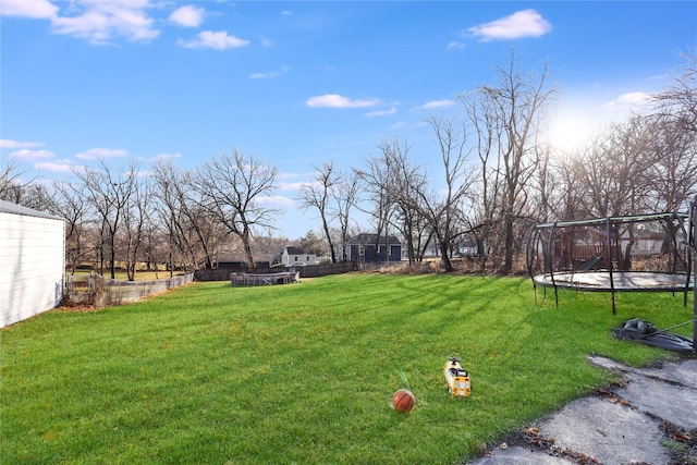 view of yard featuring a trampoline