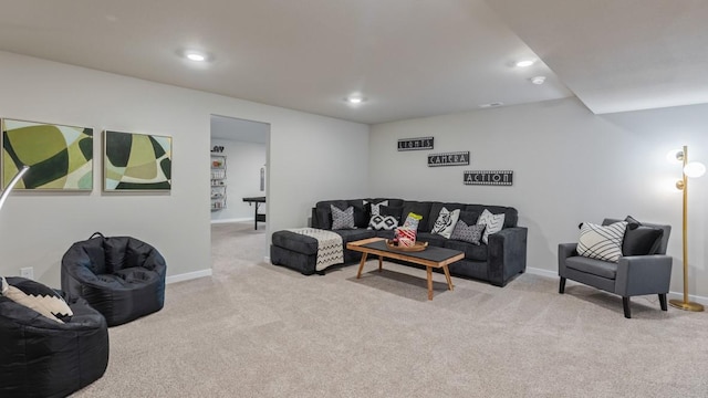 carpeted living room featuring baseboards and recessed lighting