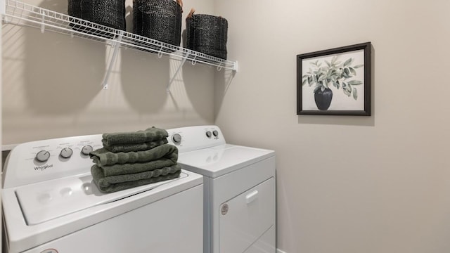 laundry room featuring washer and dryer and laundry area