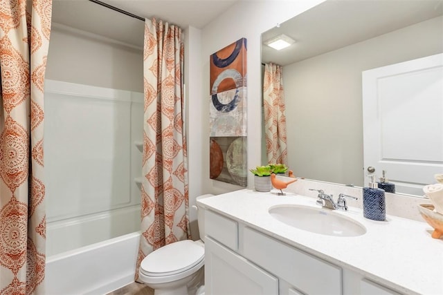 bathroom featuring shower / bathtub combination with curtain, toilet, and vanity