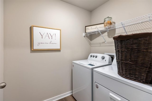 laundry room with washer and dryer, laundry area, and baseboards