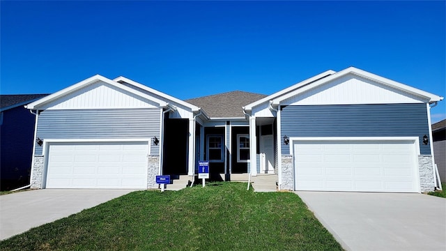 ranch-style house featuring a garage, stone siding, and concrete driveway