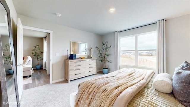 bedroom with hardwood / wood-style floors