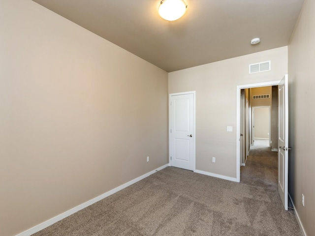 319 SW 7th St Unit 107, Des Moines, IA 50309 - unfurnished bedroom with carpet flooring and baseboards