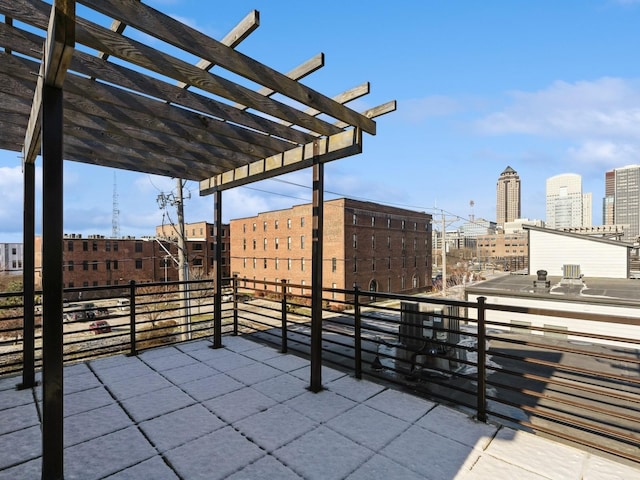 319 SW 7th St Unit 107, Des Moines, IA 50309 - patio / terrace featuring a pergola and a city view
