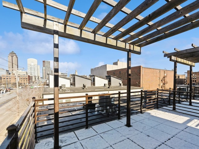 319 SW 7th St Unit 107, Des Moines, IA 50309 - view of patio with a pergola and a view of city