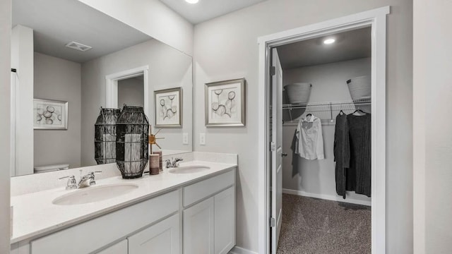 bathroom with toilet and vanity