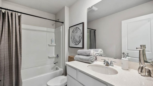 full bathroom with toilet, vanity, and shower / bath combo with shower curtain