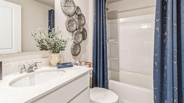 full bathroom with shower / tub combo, vanity, and toilet