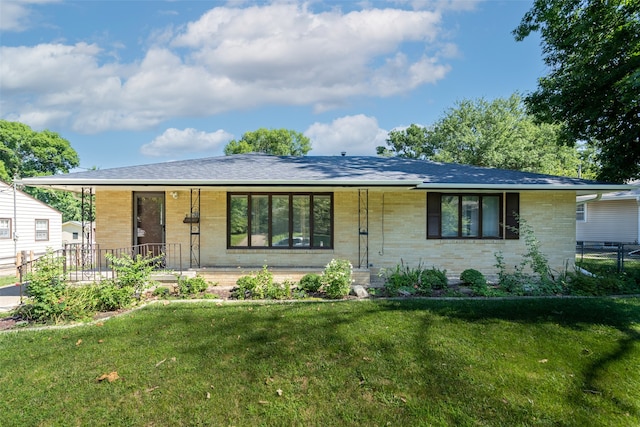 single story home with a porch and a front yard