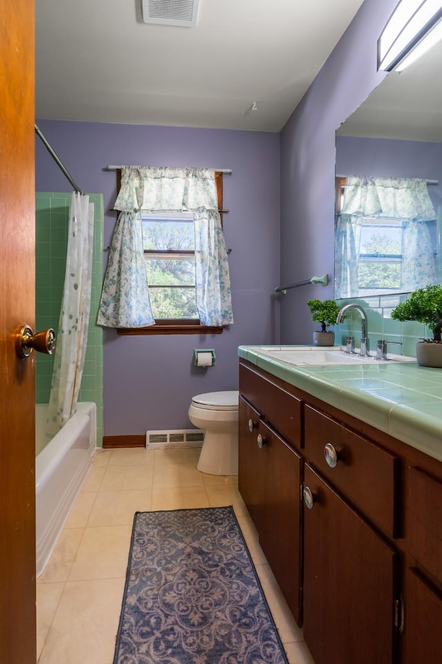 full bathroom with vanity, shower / bathtub combination with curtain, tile patterned floors, and a wealth of natural light