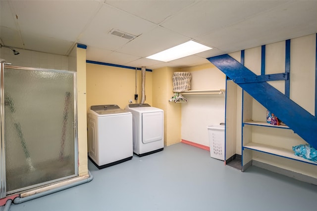 laundry area featuring washing machine and clothes dryer