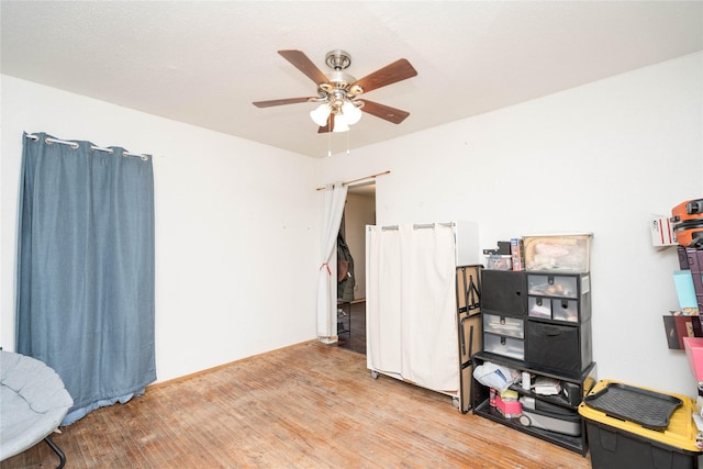 office with ceiling fan and light wood-type flooring