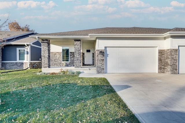 view of front of home with a front yard and a garage