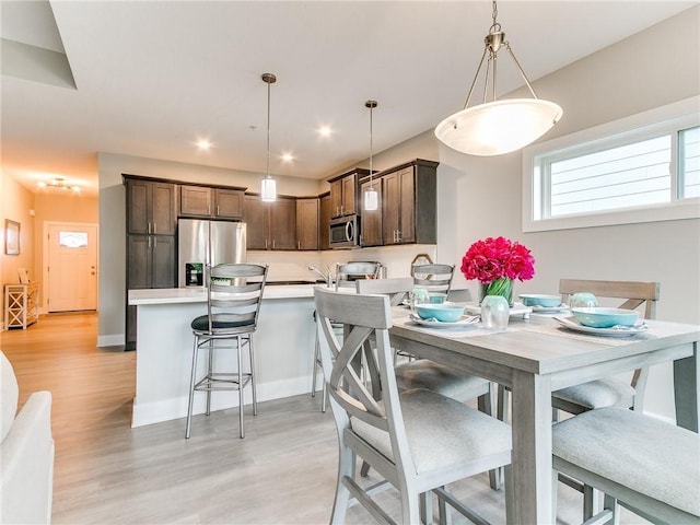 dining space featuring light hardwood / wood-style flooring