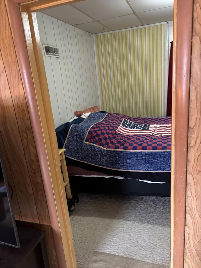 bedroom with wooden walls