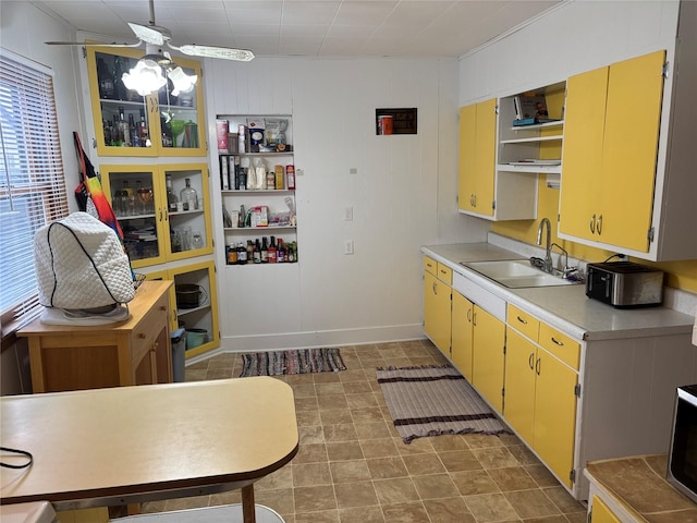 kitchen featuring a wealth of natural light, sink, and ceiling fan