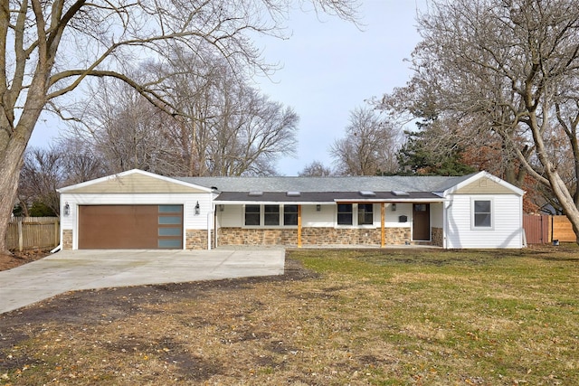 single story home featuring a garage and a front yard