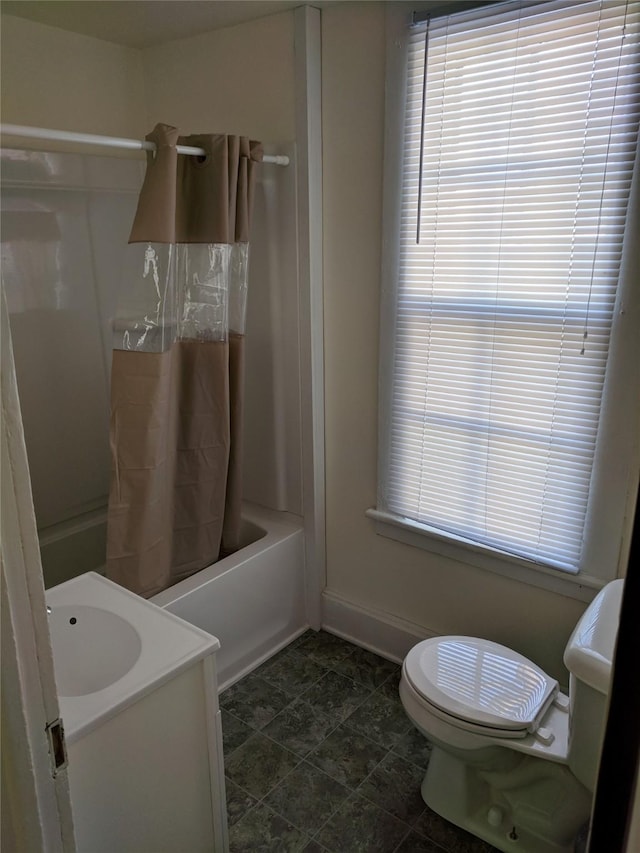 903 E St, Grinnell, IA 50112 - bathroom featuring shower / tub combo with curtain and vanity