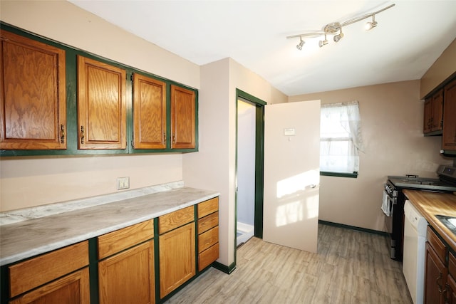 kitchen featuring white dishwasher, light hardwood / wood-style floors, and range