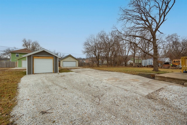 view of side of home with an outdoor structure and a garage