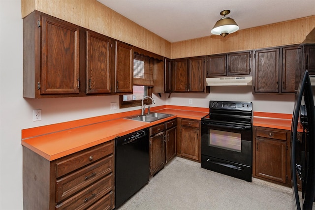 kitchen featuring under cabinet range hood, dark brown cabinets, black appliances, and a sink