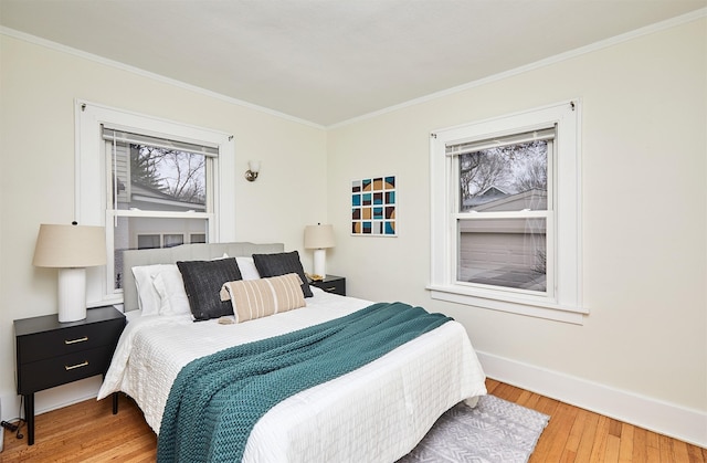 bedroom featuring crown molding and hardwood / wood-style floors