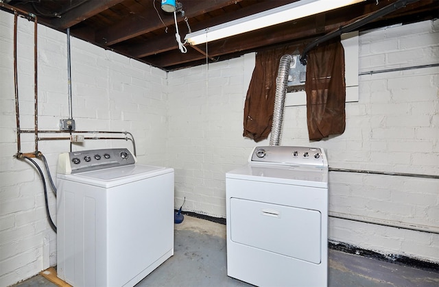 washroom with washing machine and clothes dryer