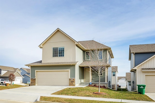 view of front of home featuring a garage and a front lawn