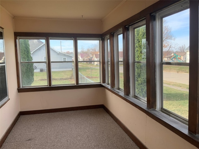 unfurnished sunroom featuring a wealth of natural light