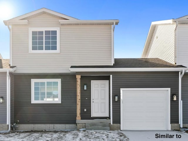 view of front of property with a garage