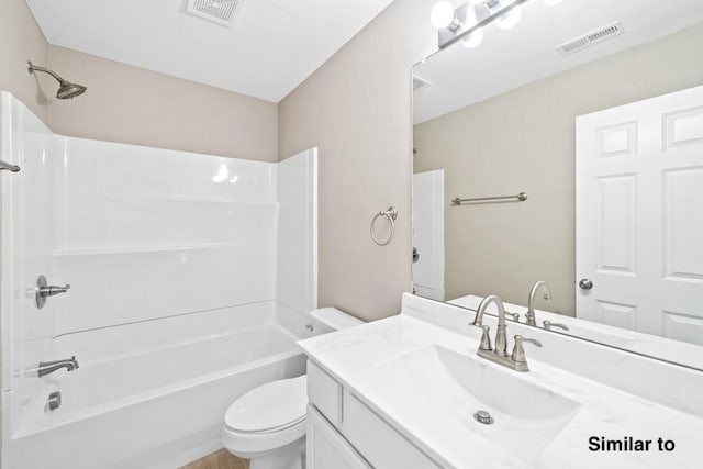 full bathroom featuring toilet, vanity, and  shower combination