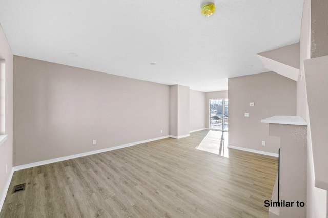 unfurnished living room featuring light hardwood / wood-style flooring