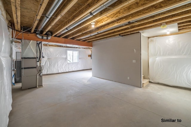 basement featuring heating unit