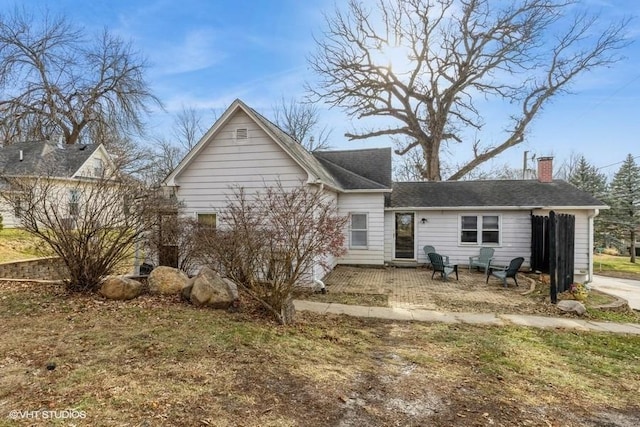 back of house with a patio