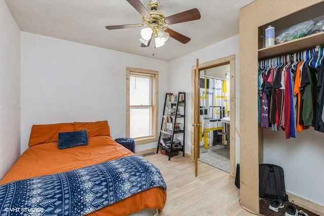 bedroom with ceiling fan, a closet, and light wood-type flooring