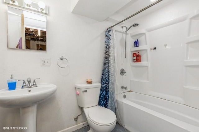 full bathroom featuring sink, toilet, and shower / tub combo