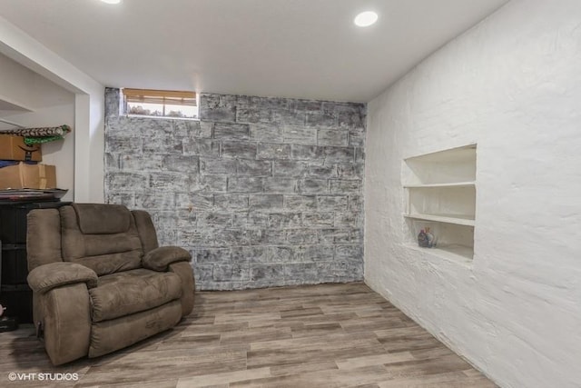 sitting room featuring built in features