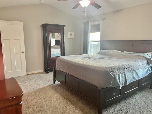 bedroom featuring carpet, vaulted ceiling, and ceiling fan