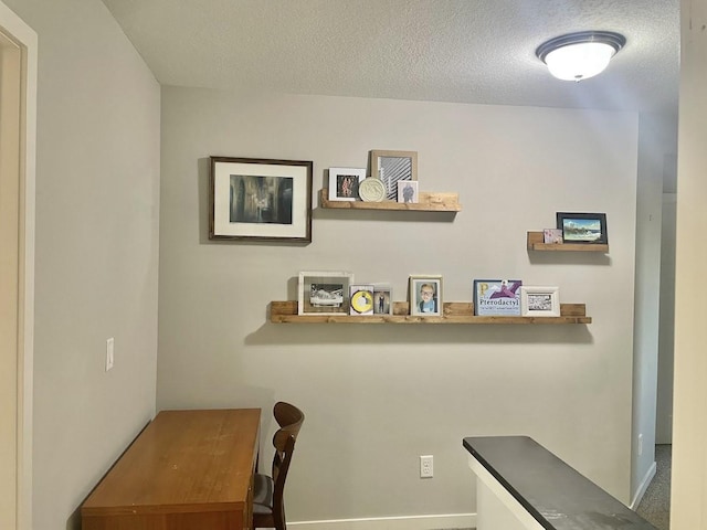 office area featuring a textured ceiling