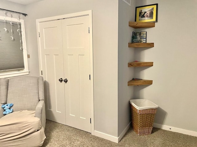 living area with carpet