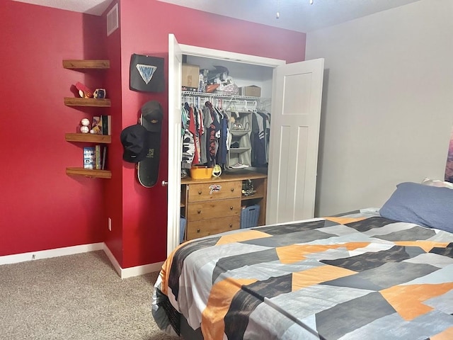 carpeted bedroom featuring a closet