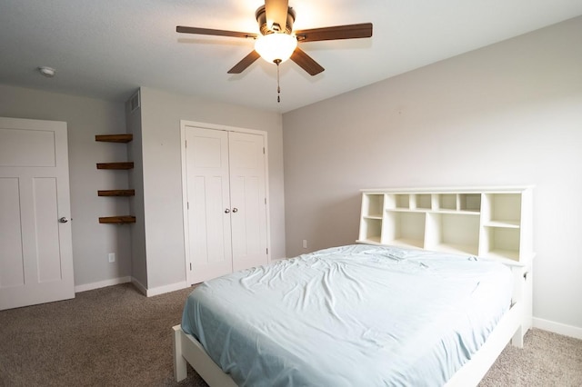 carpeted bedroom with baseboards, ceiling fan, and a closet